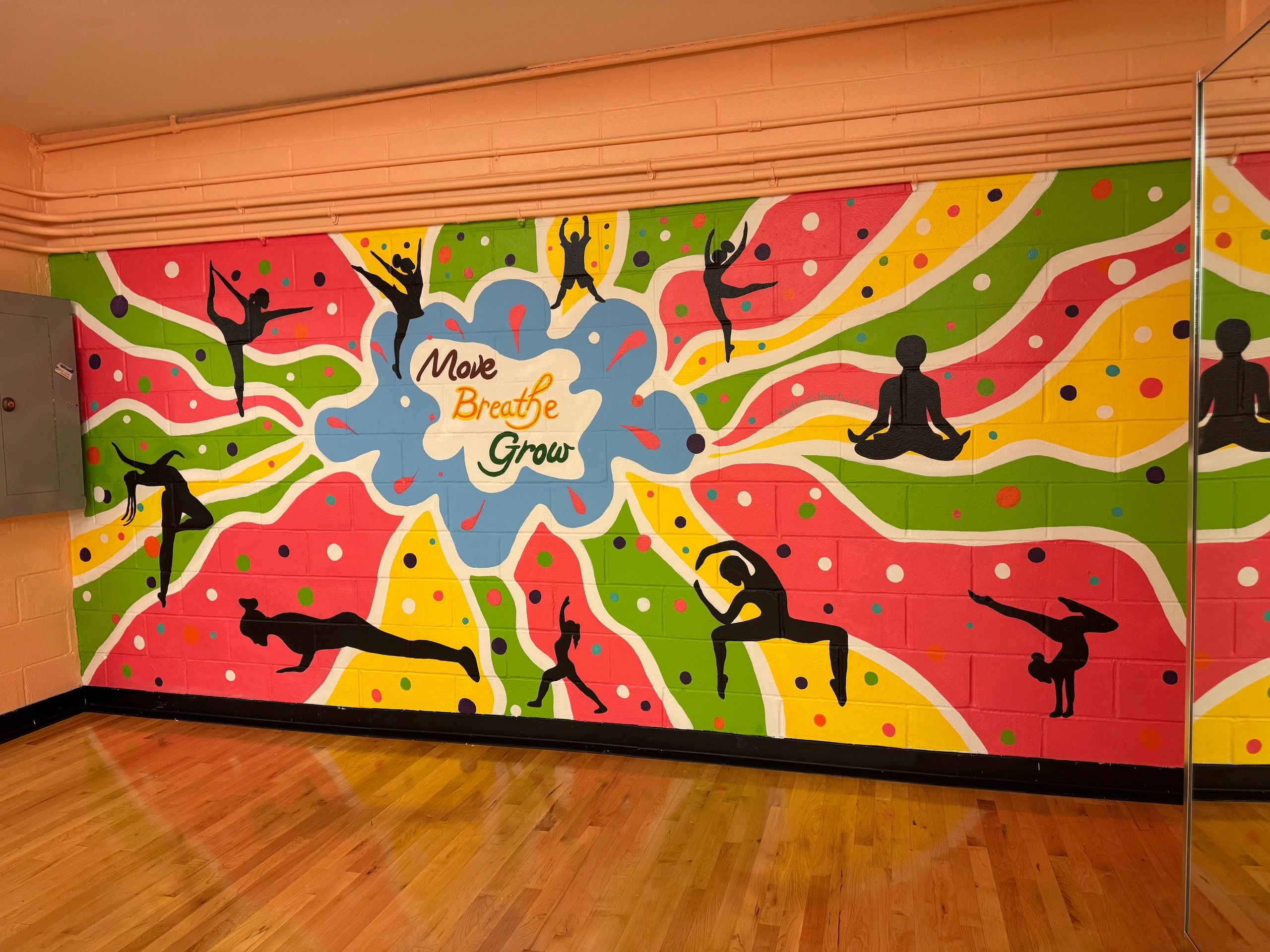 Move Breathe Grow wellness mural — corporate environment